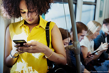 black woman on a bus where all people is with a smart phone